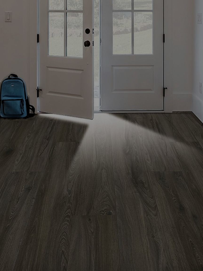Dad dancing on newly installed hardwood flooring by Flooring America