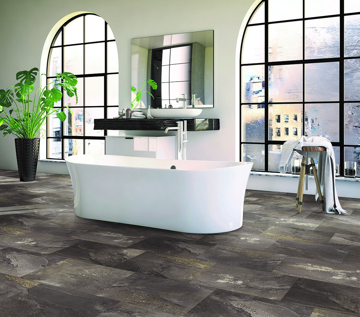 bathroom with large windows freestanding tub and vanity and large format tile flooring